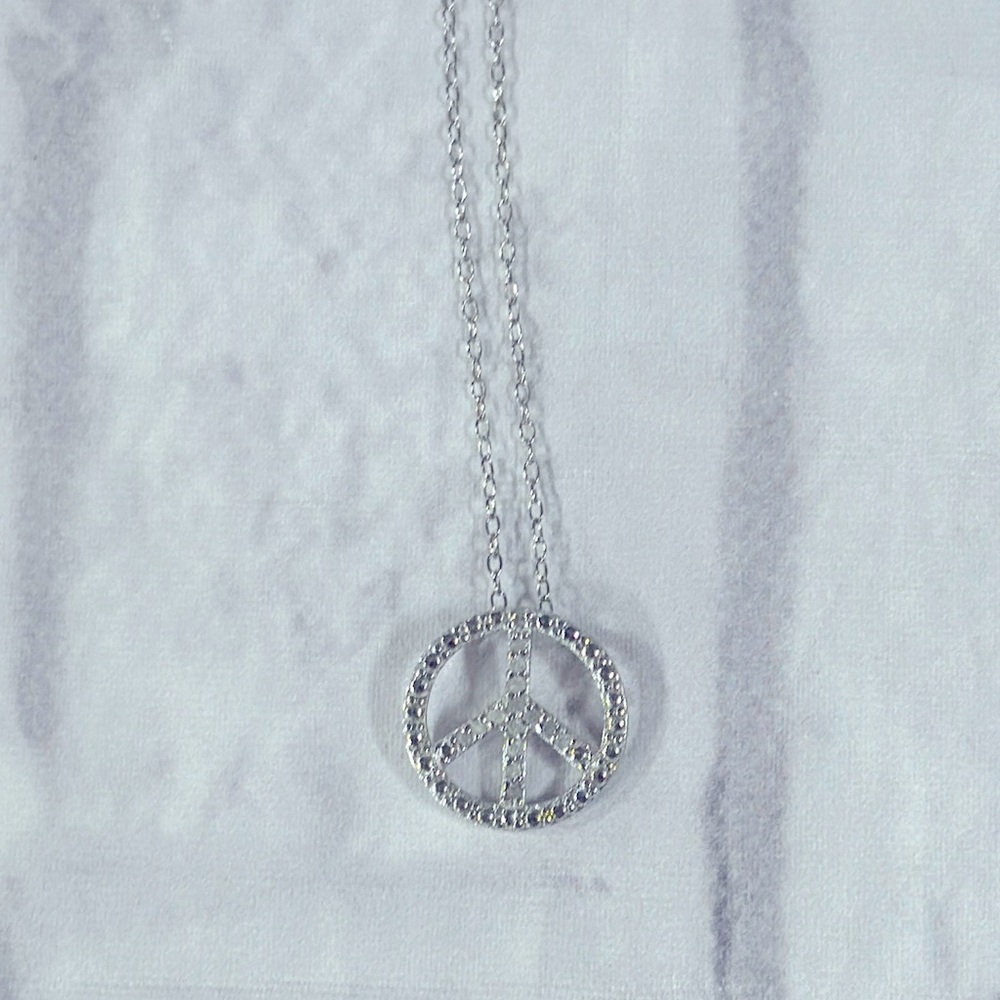 925 silver .5 inch peace pendant on 16 inch chain